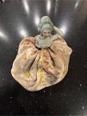 Porcelain Half-Doll Pin Cushion with Beige Fabric Skirt 
Stands 6” high